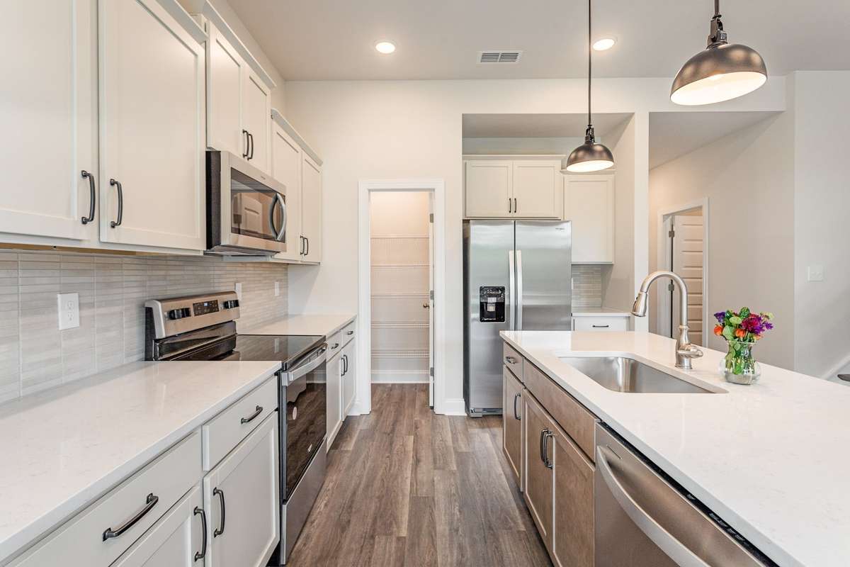 How would you like to customize your new kitchen? We have multiple options available for your cabinets, countertops, etc. We also have an option for built-in oven and microwave, and hood vent. *Photos not of exact home*