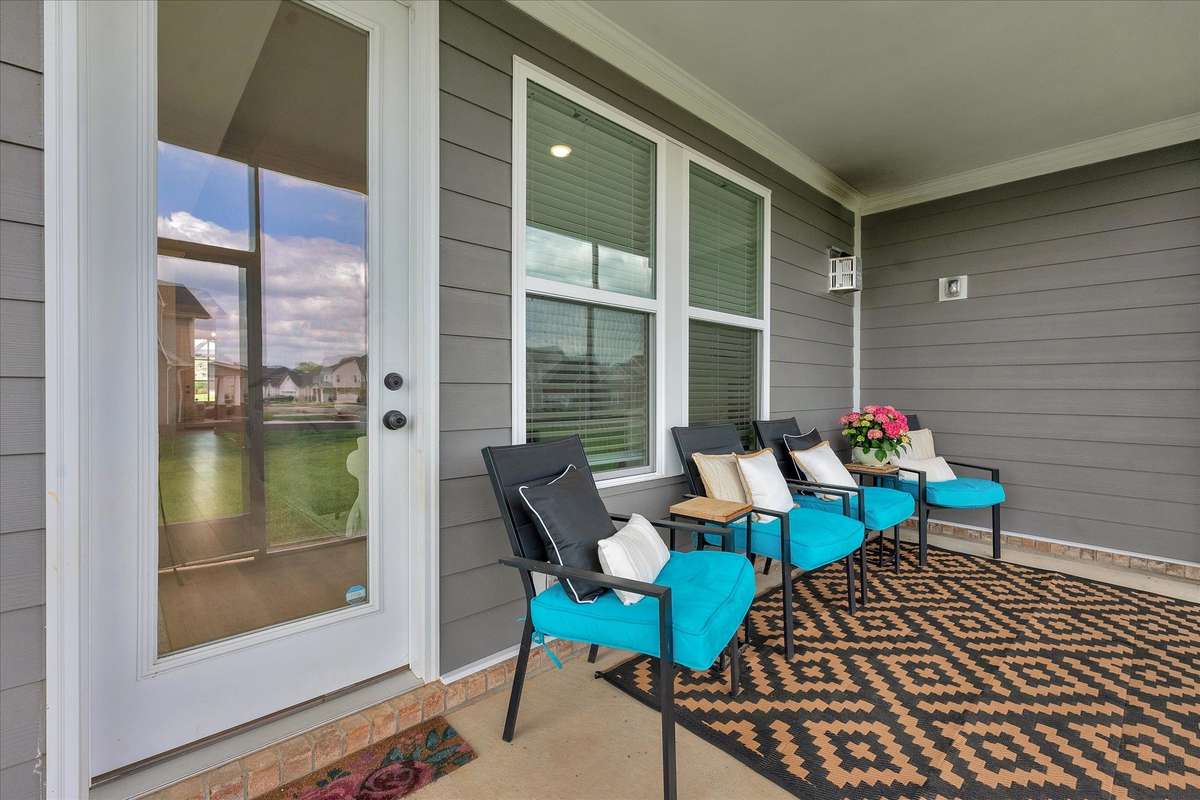 Out back you'll enjoy the evening views while not having to swat bugs. This covered patio is screened.