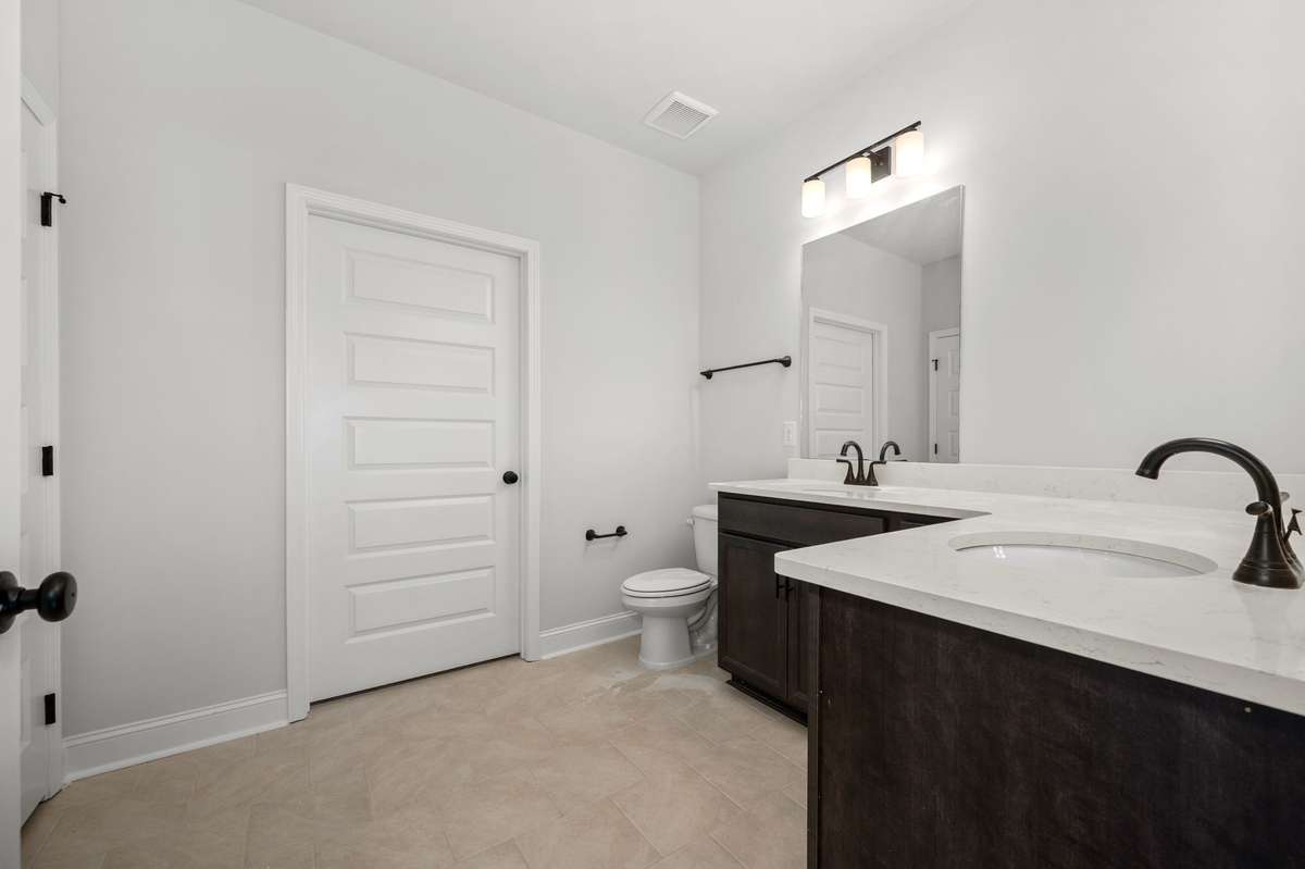 Photos shown are of a completed home of the same floorplan and are for reference purposes only. Options and colors may vary.