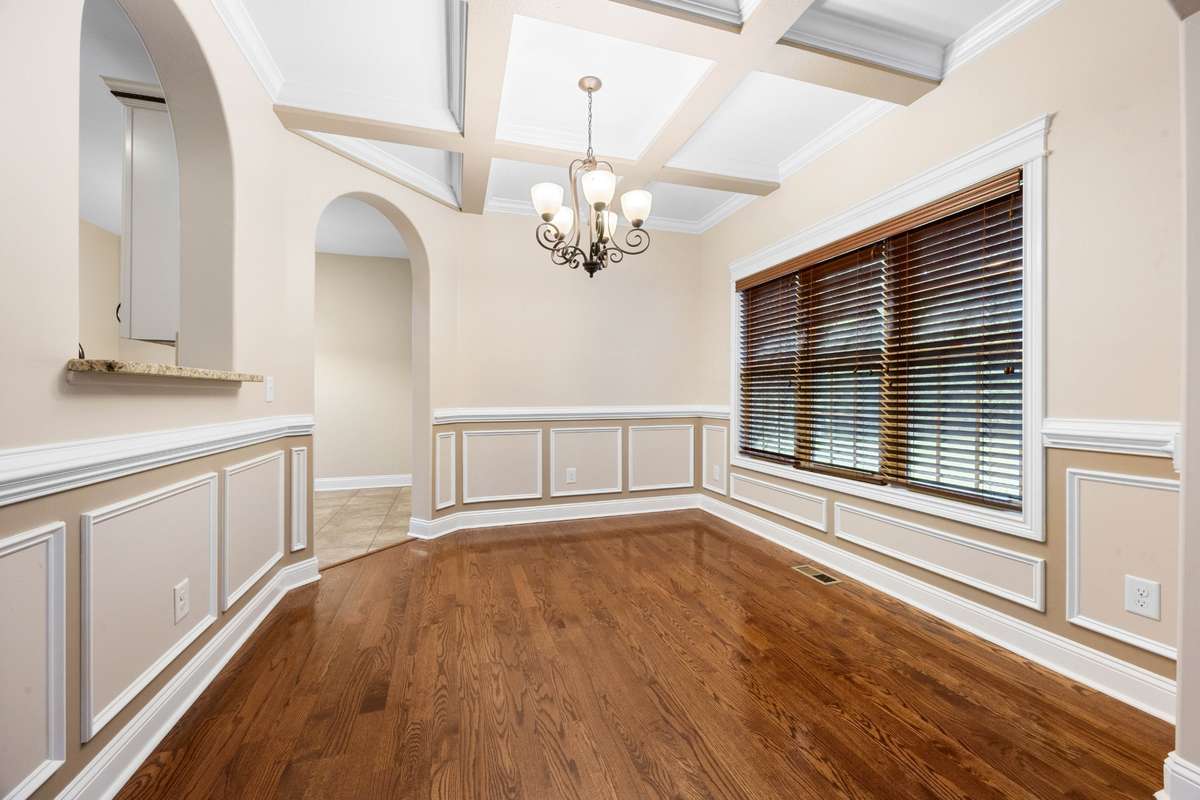 crown molding and coffered ceiling in the formal dining room