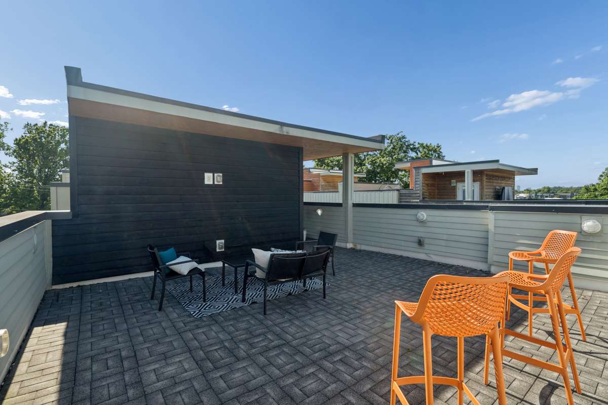 Spacious rooftop with covered area made for a tv or projector mount