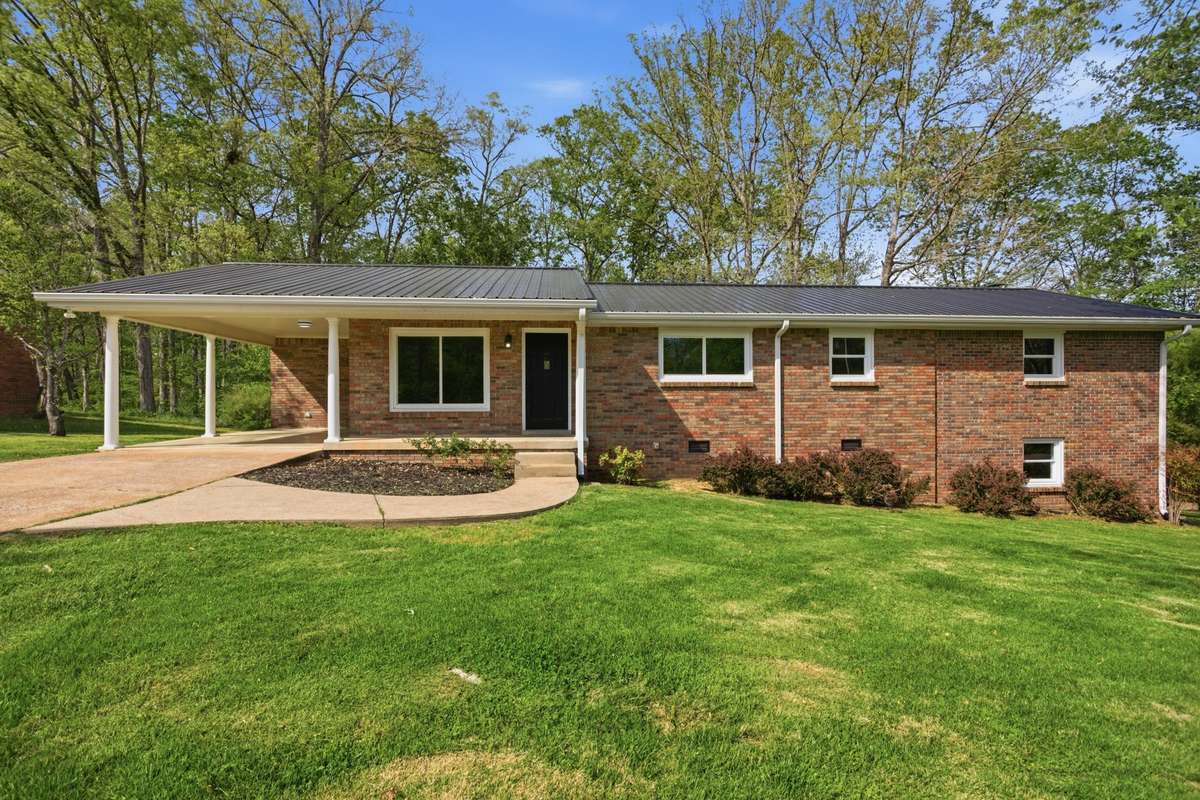 4 bedroom brick home with new roof and windows