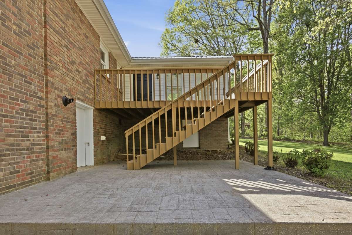 Back patio with access to tall crawl space