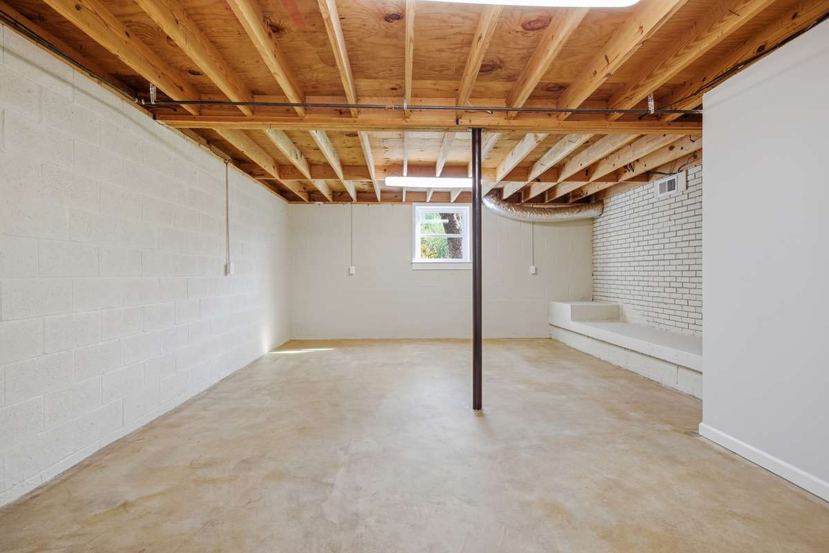 Large bonus room in basement with window and exterior access