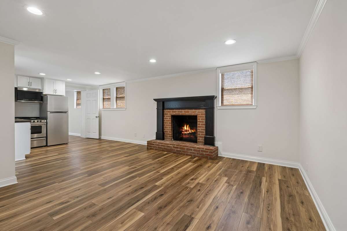 Basement view of living room and kitchenette