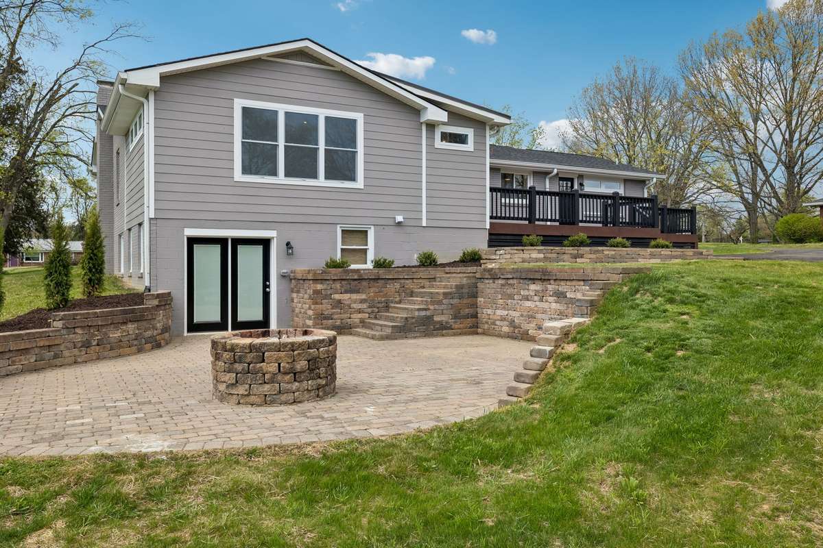 Brick patio/fire pit area off of basement