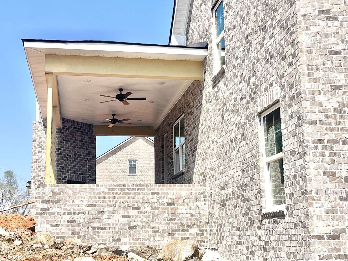 Your covered back porch with brick fireplace is under construction now! 4/2/26