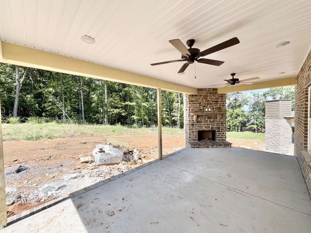 Stock photo of large back porch. Your home will have a brick fireplace