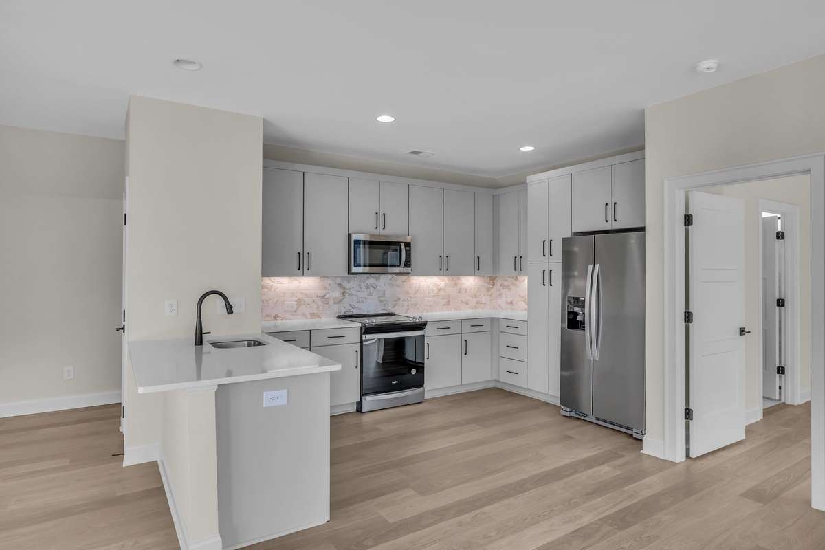 Full Apartment kitchen with dishwasher, frig, microwave and range.