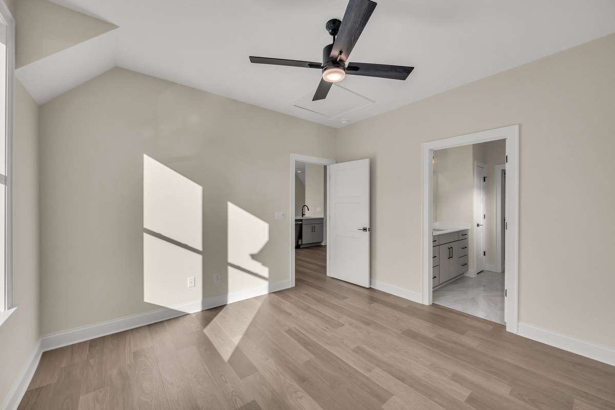 Comfortable apartment bedroom with ensuite bath.