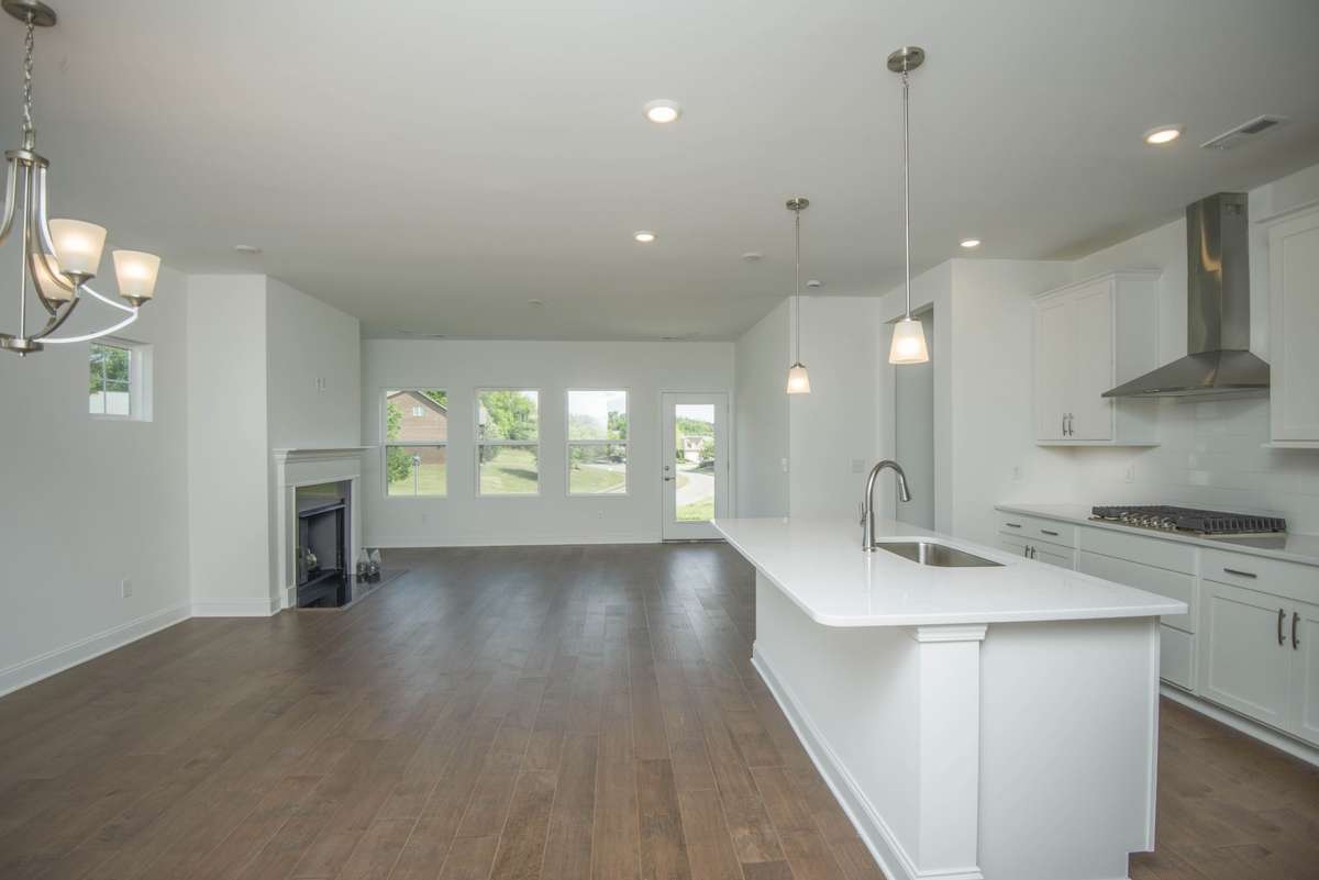 Photos displayed are of a model home. Actual options, finishes, colors, and selections may differ in the home being offered for sale.