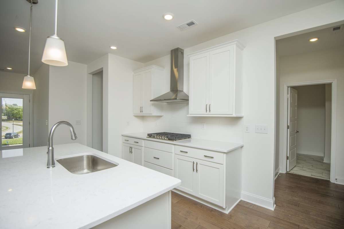 Photos displayed are of a model home. Actual options, finishes, colors, and selections may differ in the home being offered for sale.