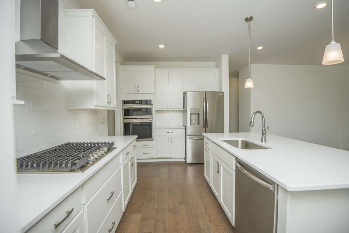 Photos displayed are of a model home. Actual options, finishes, colors, and selections may differ in the home being offered for sale.
