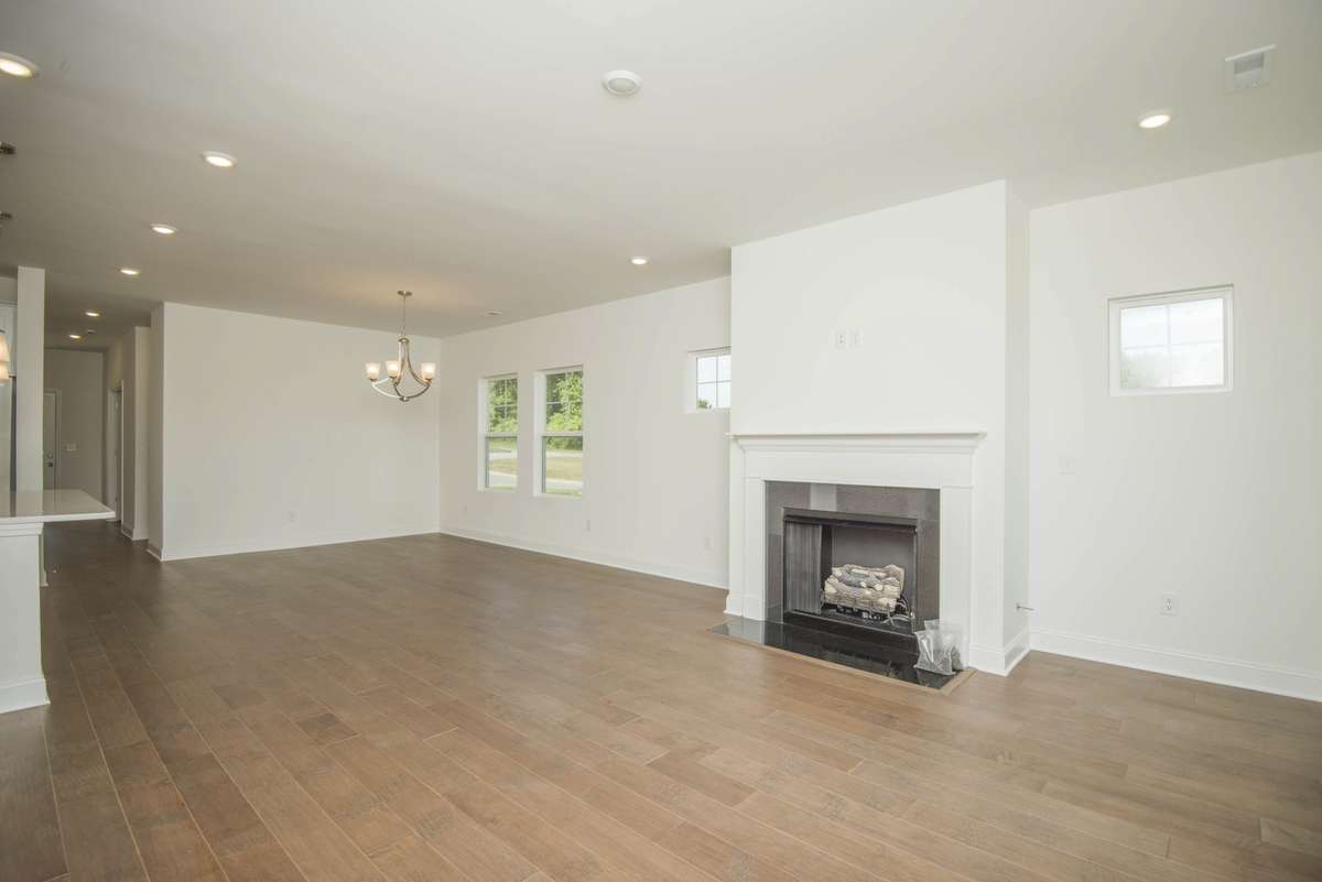 Photos displayed are of a model home. Actual options, finishes, colors, and selections may differ in the home being offered for sale.