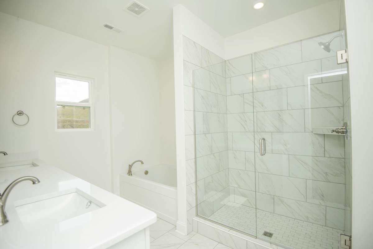 Photos displayed are of a model home. Actual options, finishes, colors, and selections may differ in the home being offered for sale.