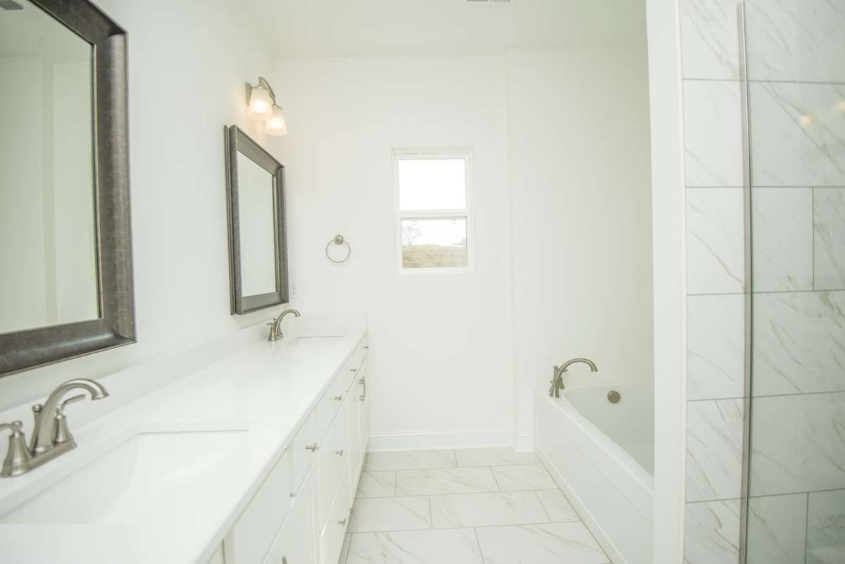 Photos displayed are of a model home. Actual options, finishes, colors, and selections may differ in the home being offered for sale.