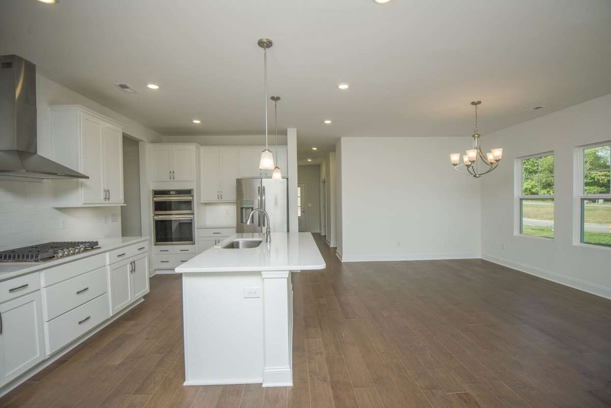 Photos displayed are of a model home. Actual options, finishes, colors, and selections may differ in the home being offered for sale.