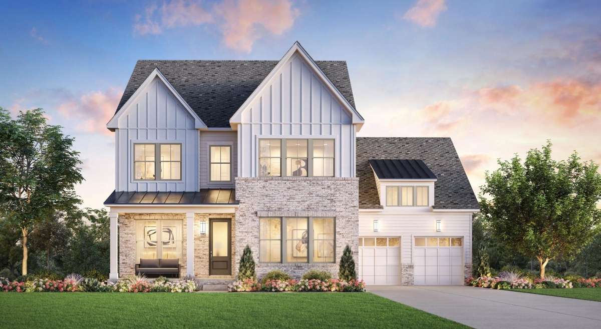 This is Toll Brothers Fauna, in a Modern Farmhouse elevation, includes a primary and secondary suite on the main floor, as well as an office.