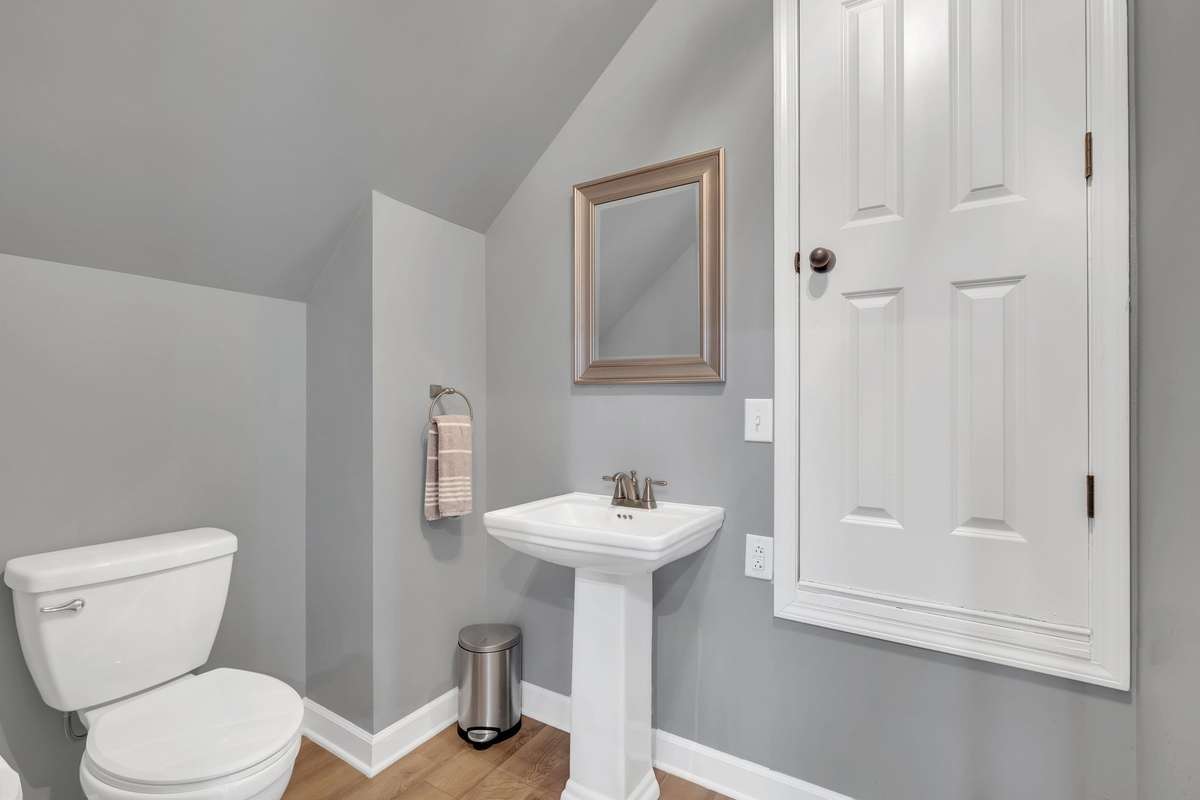 Upstairs Half Bath which also leads to a floored attic space!