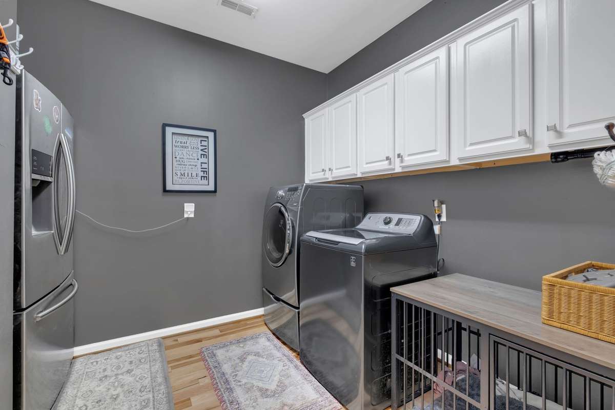 This laundry room is amazing!  Room for an extra fridge, storage and anything else you need!