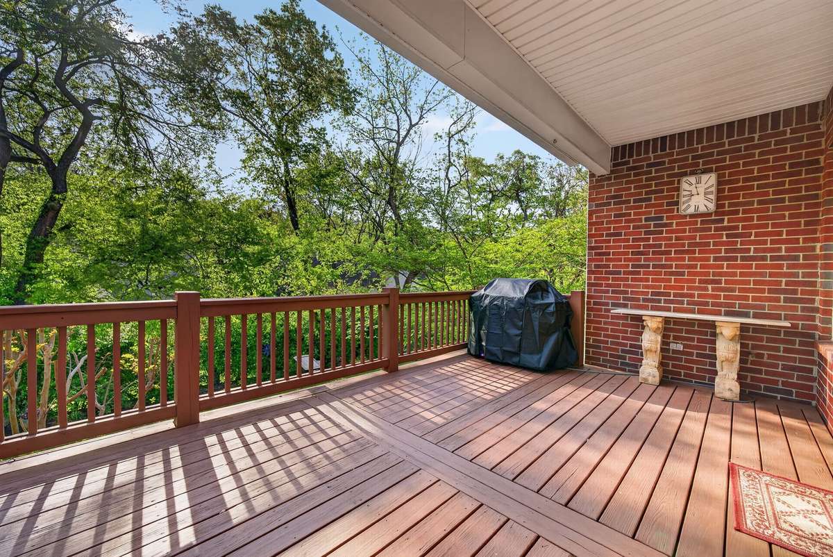 Deck off the kitchen. This grill has a gas hookup available at the wall.