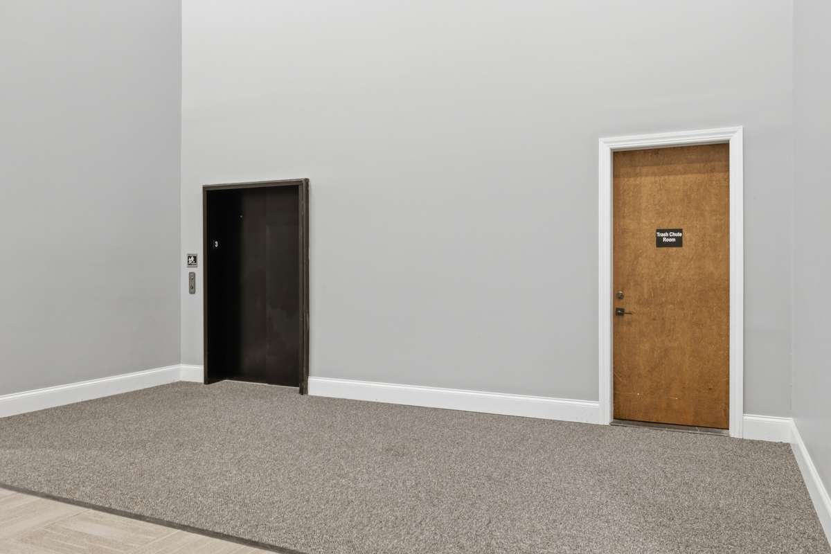 Service elevator directly access from the back of the bldg.-easy access for moving or large delivery and for pet walk.  Trash Shute door.