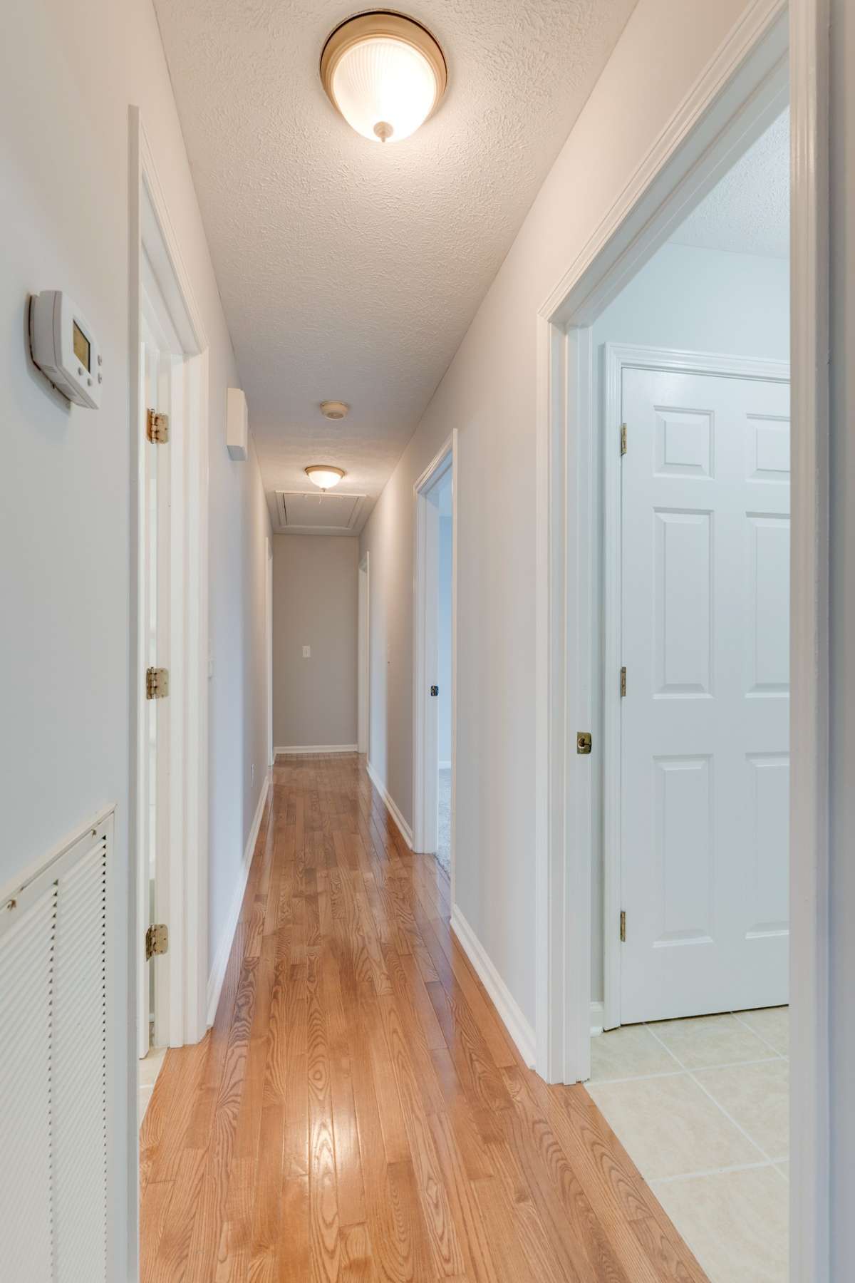 To the right you'll find a HUGE tiled laundry room with a separate entrance to the back deck!