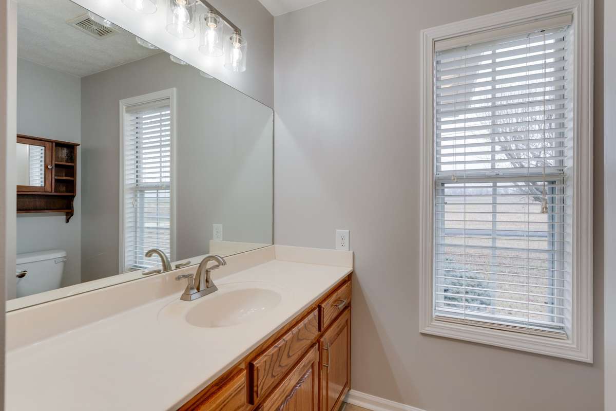 Spacious bathroom with plenty of natural light and storage!