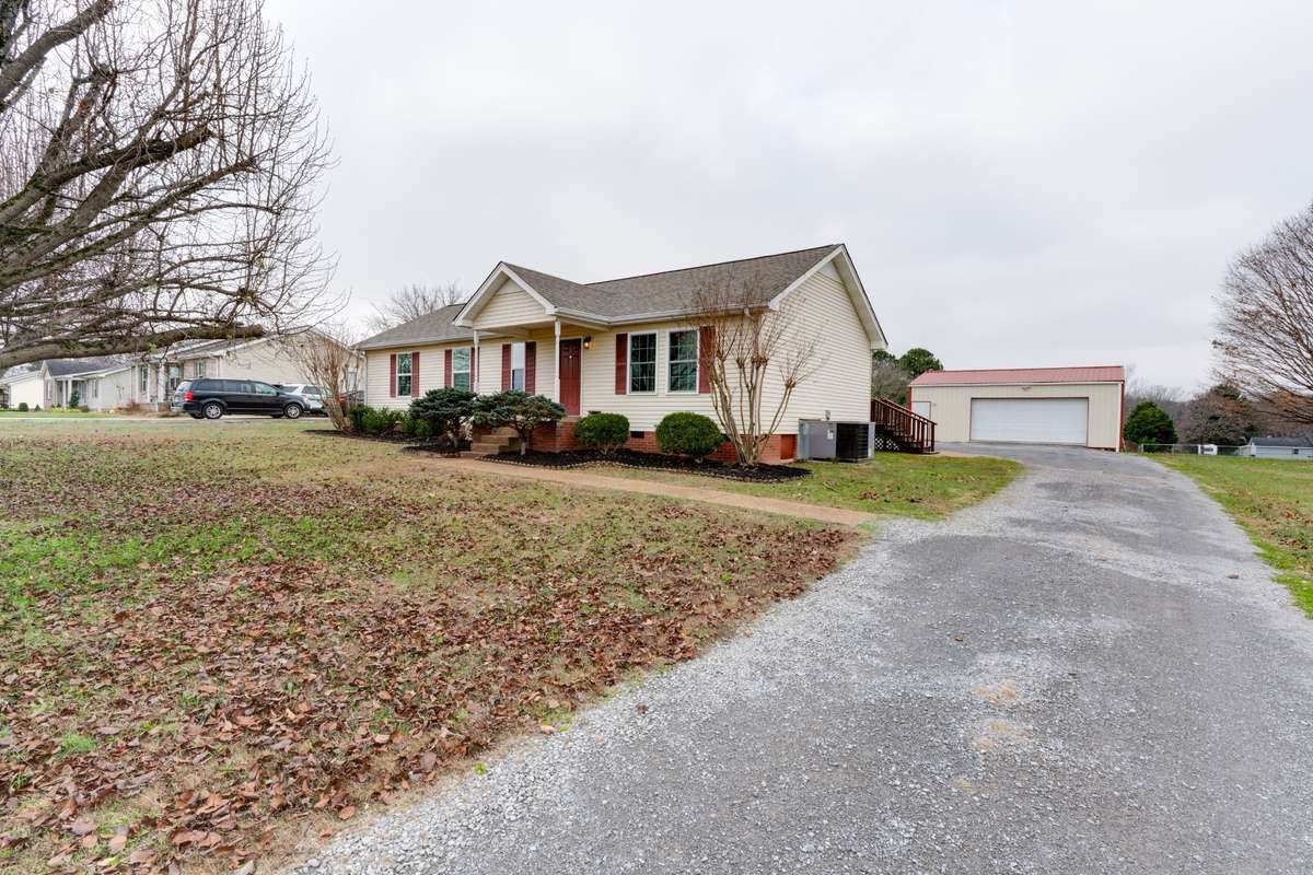 Drive right up to the deck stairs, or continue on to keep your car in the two-car garage with garage door opener.