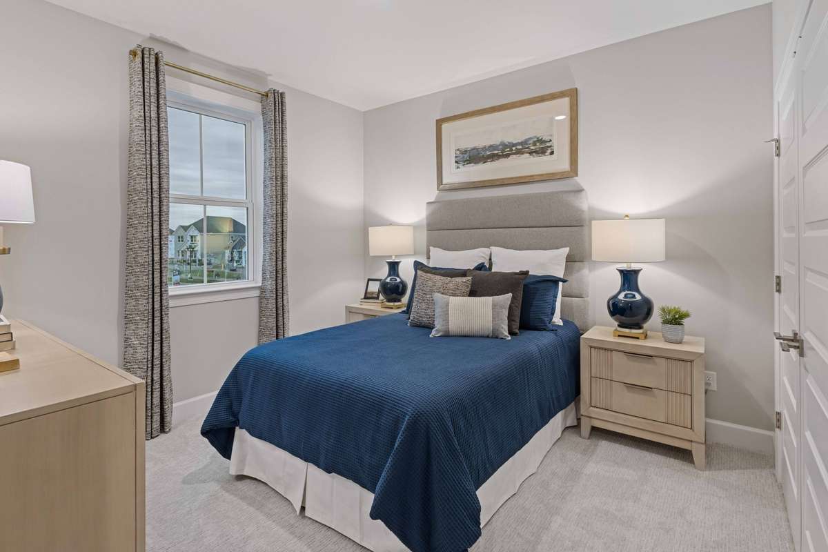 1 of 3 guest bedrooms upstairs with double door closet & additional nook for vanity, desk, or whatever works best for your needs!