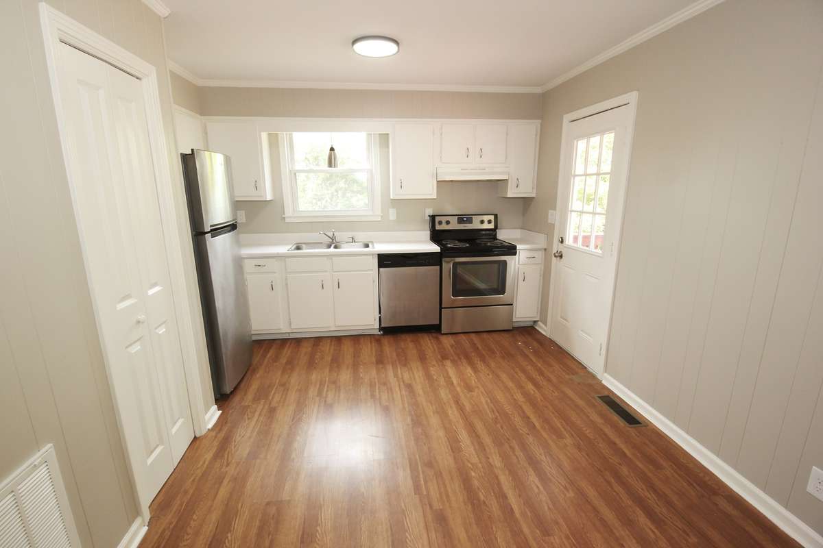 Full kitchen with access the large back deck, Unit B