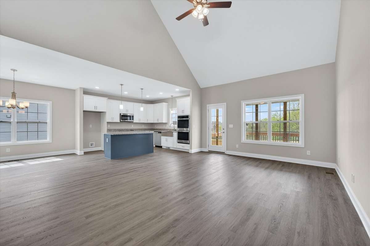 Open kitchen featuring large island overlooking the main living area.