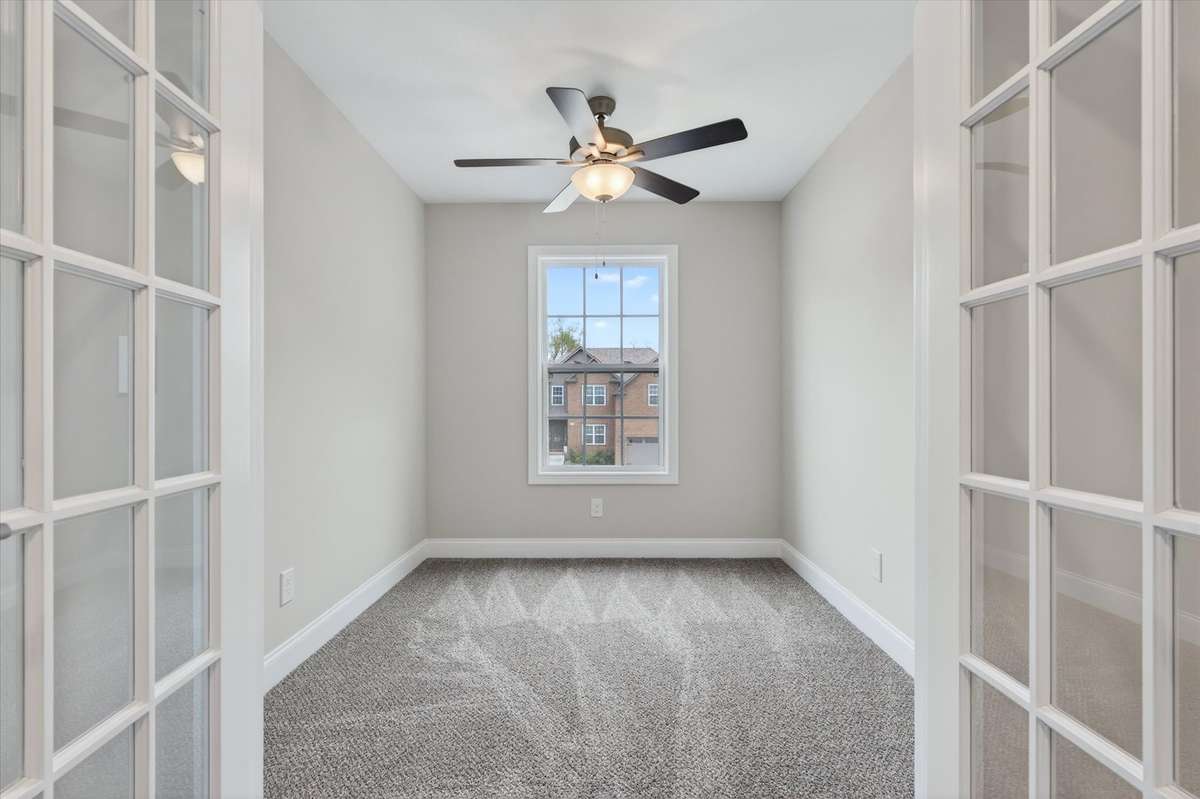 Private office or flex space with French doors—ideal for working from home