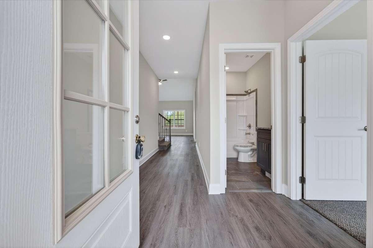 Bright entry hallway with modern flooring and clean, open flow into main living areas