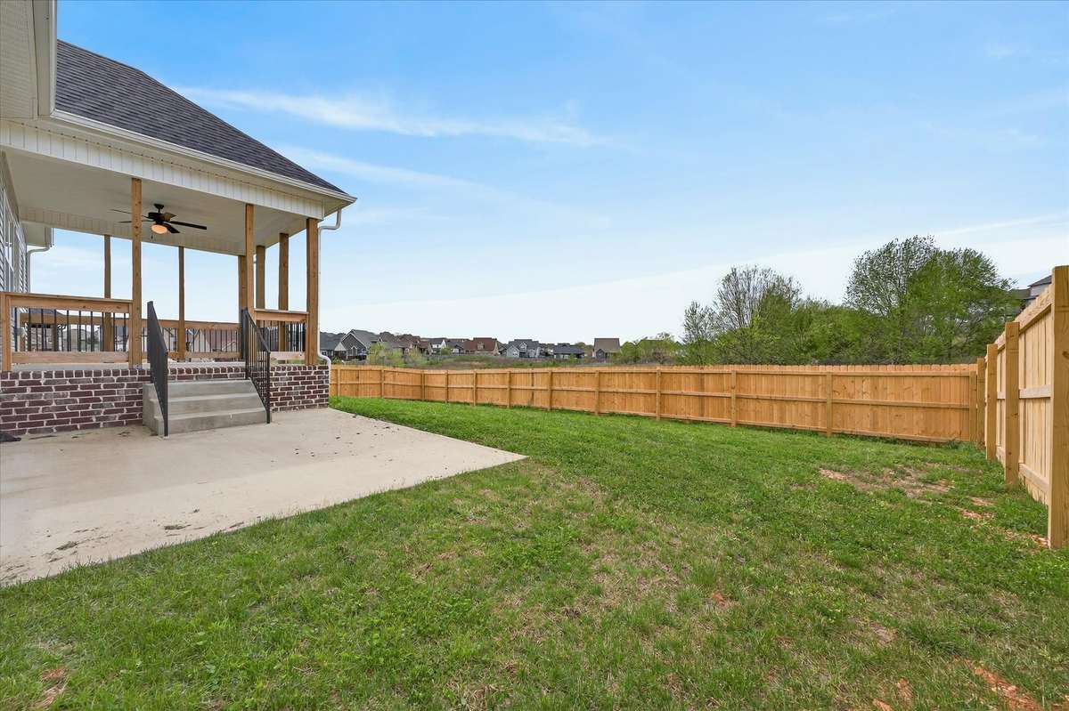Backyard with covered patio—perfect for relaxing or entertaining