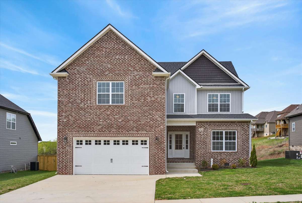 Beautiful all-brick front exterior with two-car garage and great curb appeal.