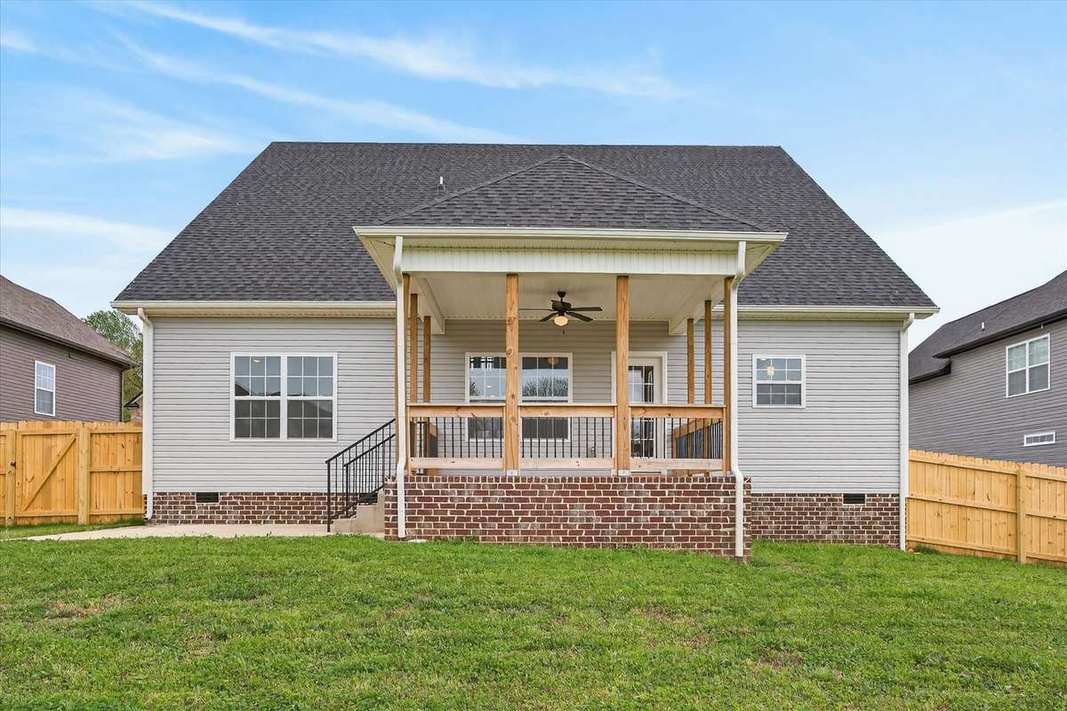 Spacious backyard with covered patio—perfect for outdoor relaxing or entertaining