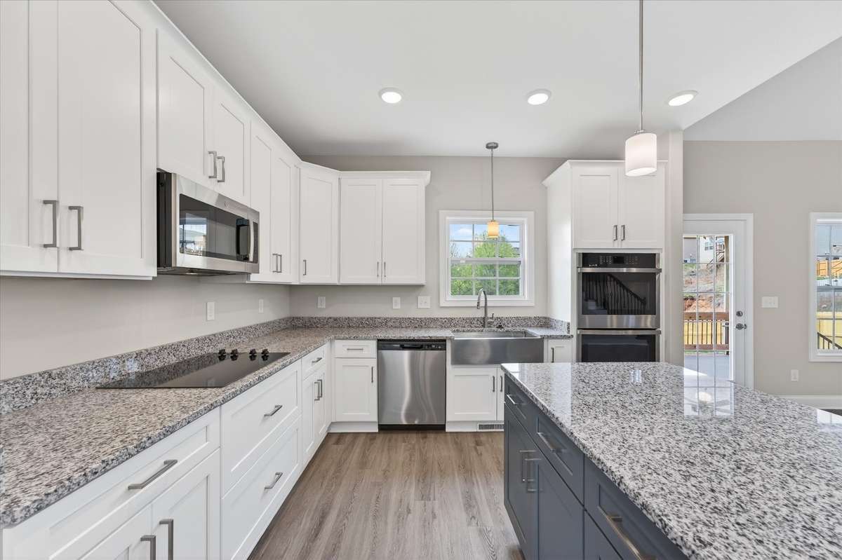Modern white cabinetry and stainless steel appliances