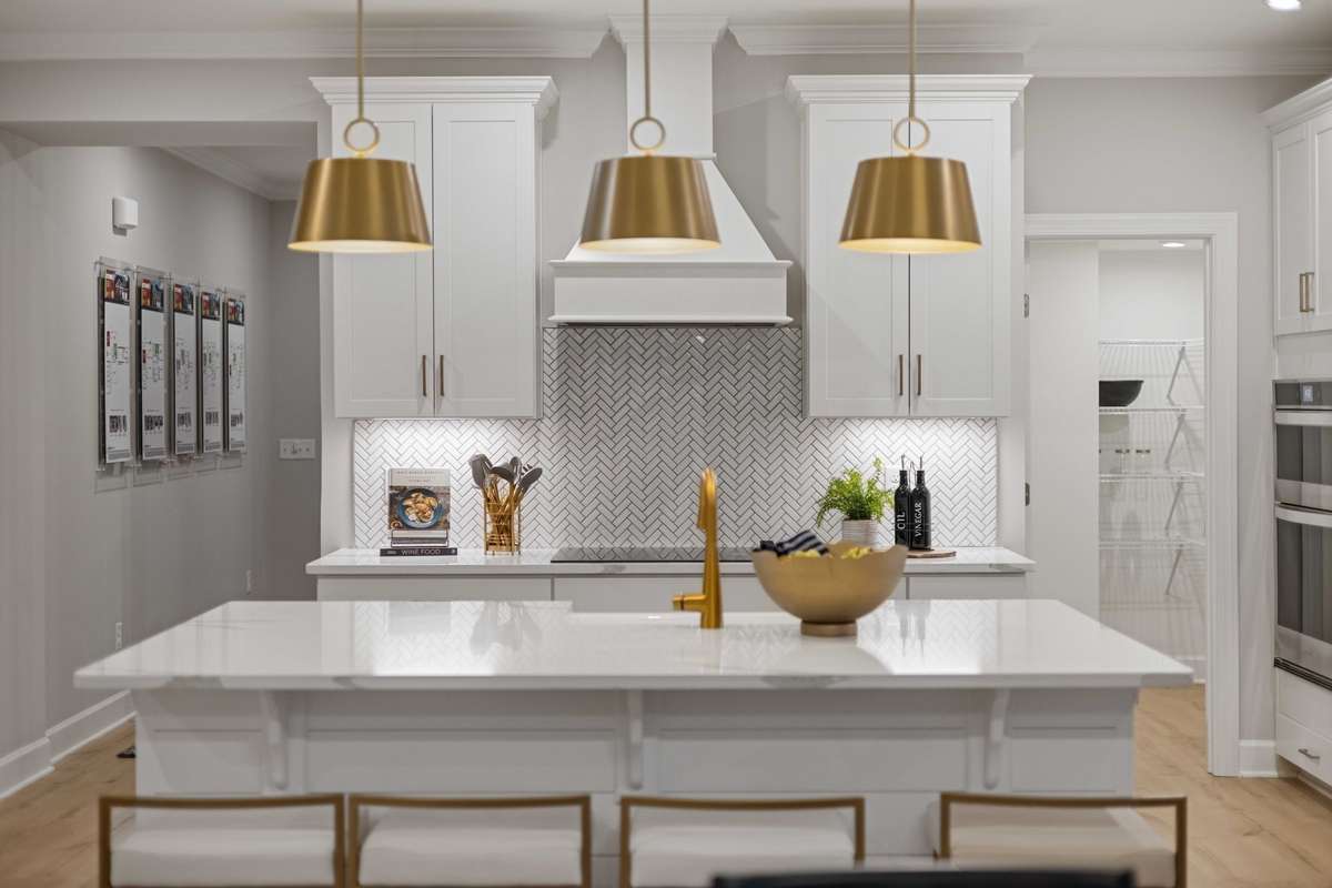 Stunning gourmet kitchen includes built in double wall ovens, cabinets to the ceiling, quartz countertops, ceramic tile backsplash, and SS appliances! Choose from 2 kitchen layouts at NO COST!! New elevated island design included and not pictured.
