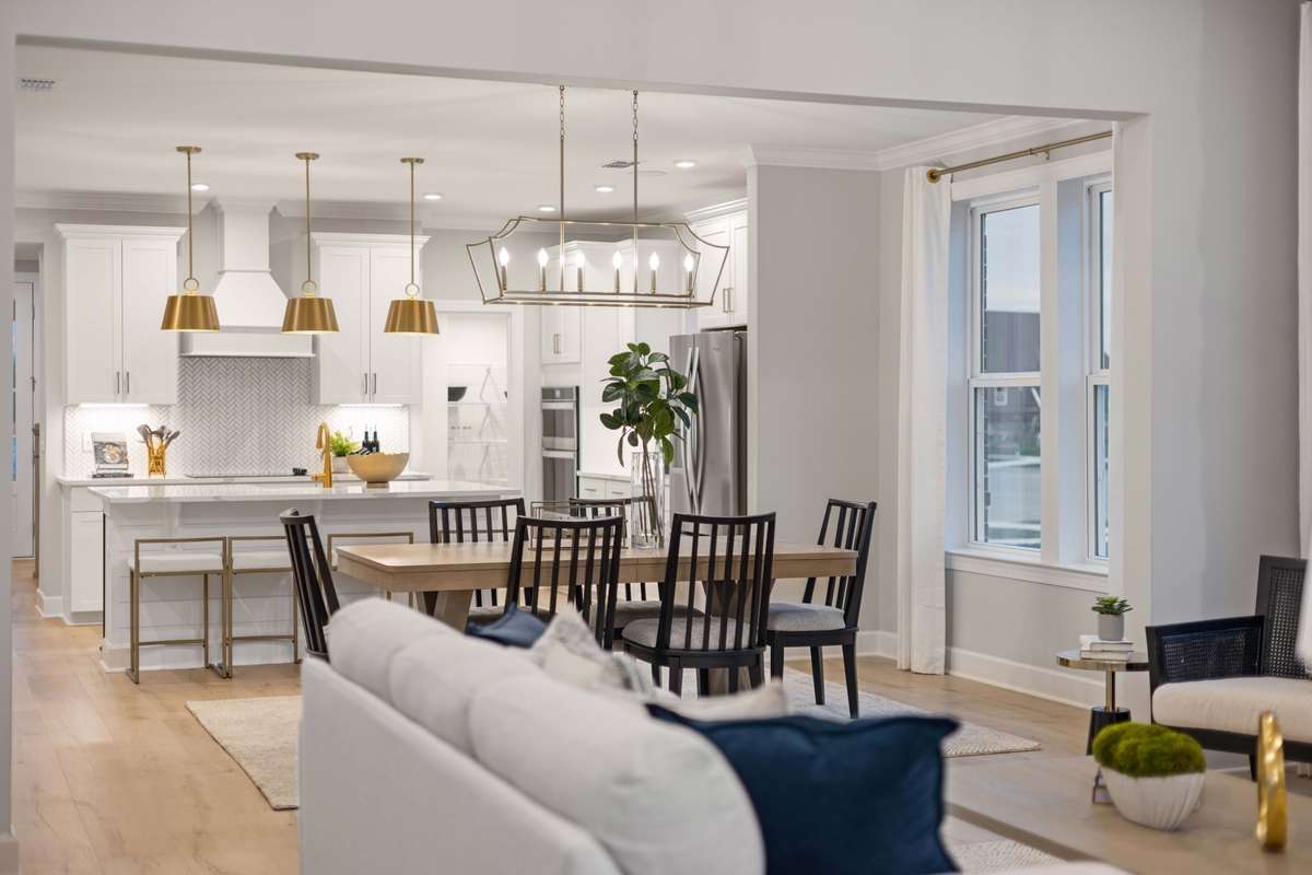 Dedicated dining space before the great room keeps the entertainer's flow going!