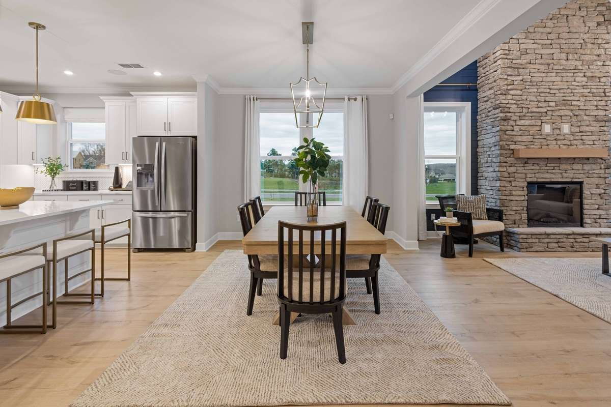 Dedicated dining space before the great room keeps the entertainer's flow going!