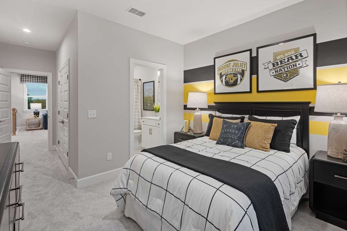 Guest suite upstairs features full bathroom & walk-in closet.