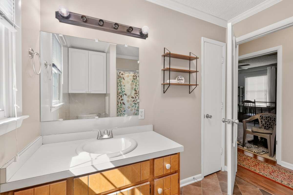 The bathroom has enough room to move around with two people