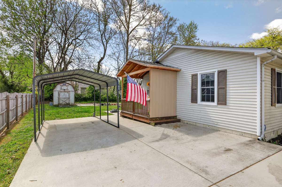 Carport for car stays and there is a nice little stoop porch built on to house for privacy from the road