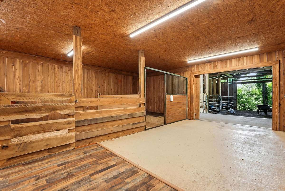Private cedar lined stalls , Tack and 1/2 Bath .