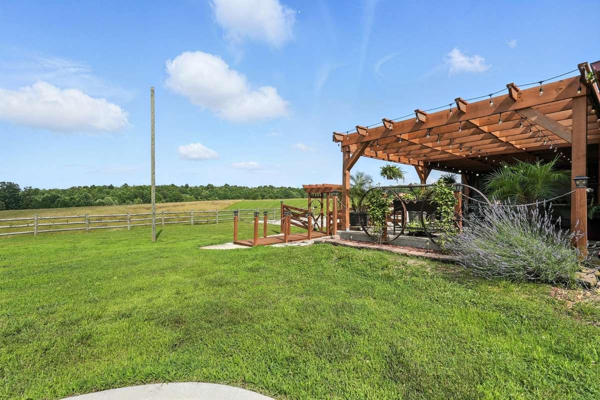 Pergola serves as a cozy outdoor Grilling area .