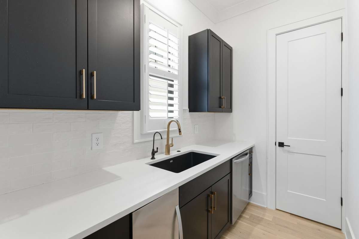 Butlers pantry off the kitchen with access to the walk-in pantry. Ice maker and second dishwasher to stay.