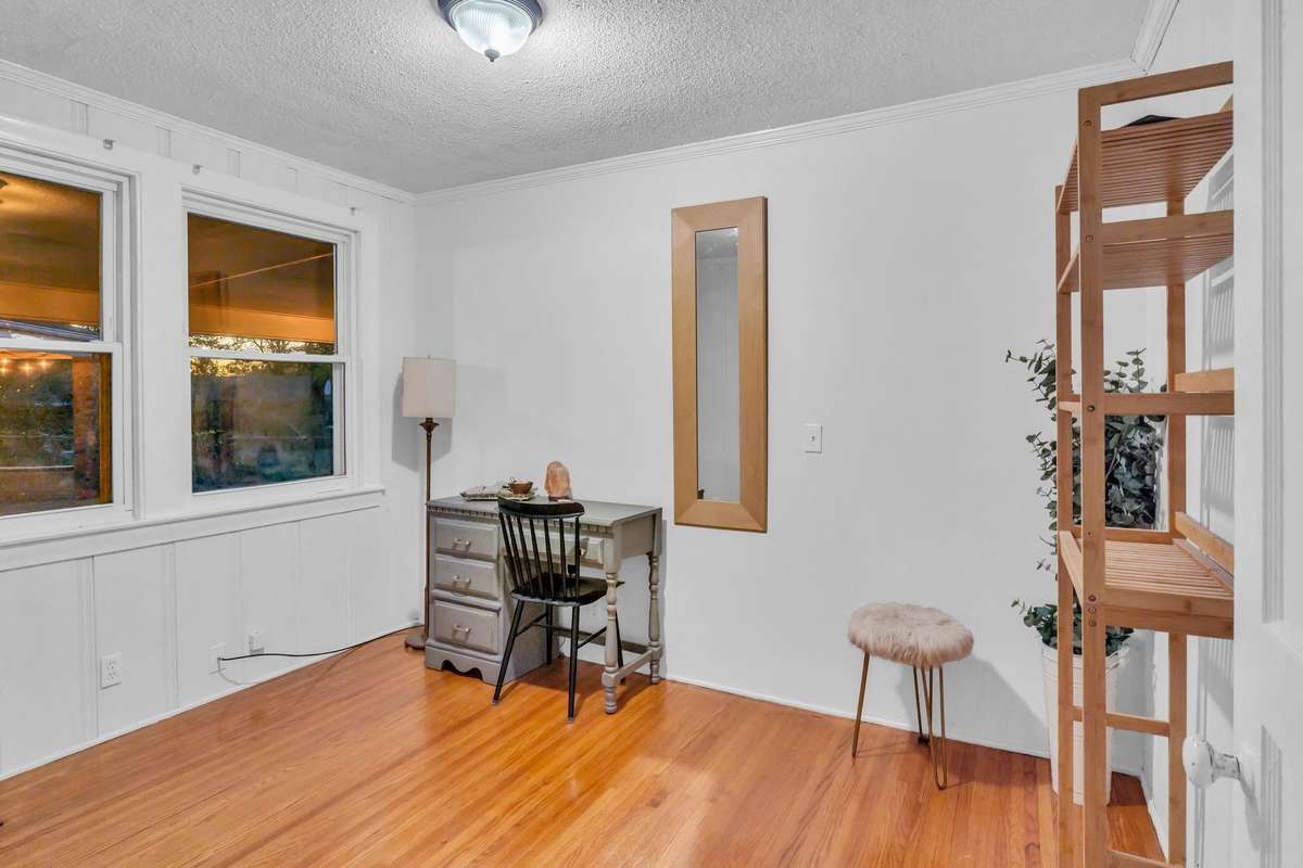 bedroom #3 with beautiful original hardwood floors and vinyl windows