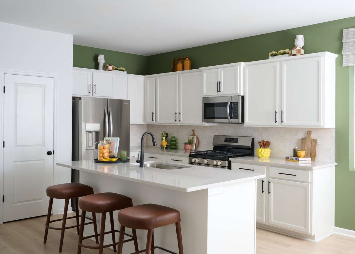 Huge island included in this plan. Photo of our furnished model home - colors may vary, see sales for specifics