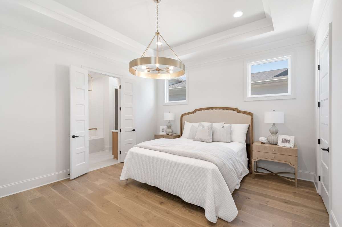 Primary Bedroom with hardwood flooring.